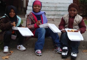 Fatima, 3, Sumayya, 10, and Jumu‘ah, 8 on a Sunday afternoon in February at the weekly masjid Al-Haqq soup kitchen.
